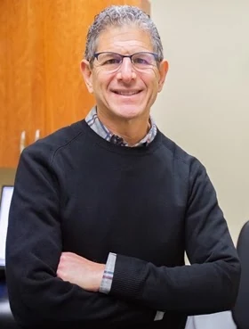 Dr. Daniel Mirkin smiling at the practice
