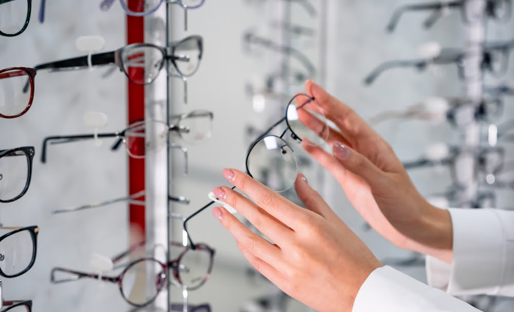 Optometrist choosing eyeglasses - Eyeglasses in Rockaway Park, NY