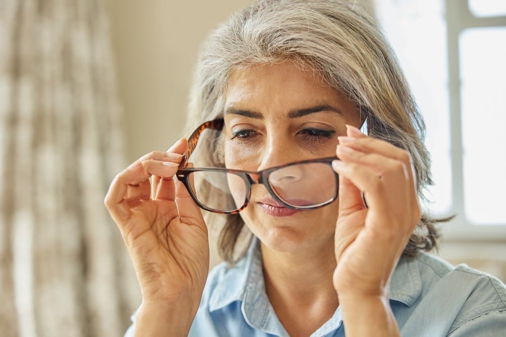 Middle-aged woman wearing glasses - Eye Exam in Queens, NY Middle-aged woman wearing glasses - Eye Exam in Queens, NY